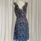 Conspiracy Vintage Sleeveless Dress - Elegant Black and White Leaf Print with Ruffles - Image 1