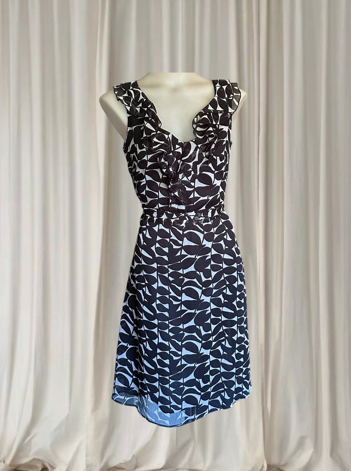 Conspiracy Vintage Sleeveless Dress - Elegant Black and White Leaf Print with Ruffles - Image 1